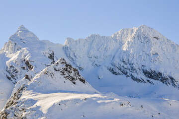 Naklejka premium View of Kościelec Mountain and Świnica Mountain and Świnica Ridge in winter in High Tatras, Tatrzanski Park Narodowy, Poland