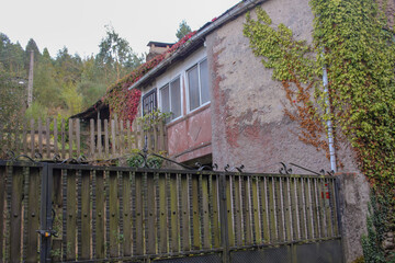Weathered house ruins in quiet valley