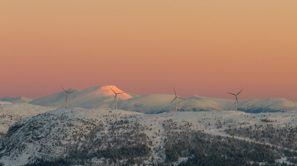 Wind turbines on a mountain at sunrise