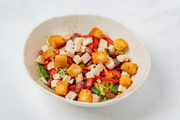 Colorful salad featuring grilled chicken, crunchy croutons, and fresh vegetables perfect for lunch