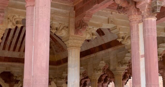 Interior detail architecture with many pillars of historic Amber fort in Jaipur, India.
