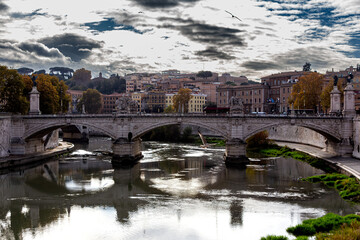 The monumental Ponte Vittorio Emanuele II, with its dramatic stone arches and classical sculptures,...