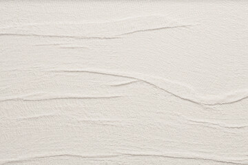 Empty relief crumpled wave craft canvas fabric blank texture copy space background. Gray beige neutral color.