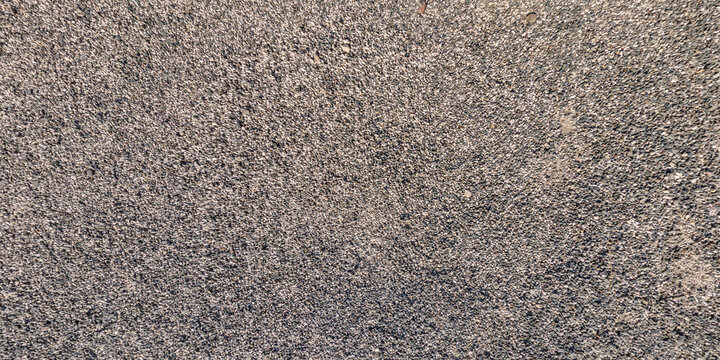panorama view from above on surface of small pebbles and stones on sea coast