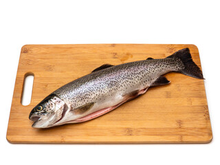A fish sig is on a wooden cutting board