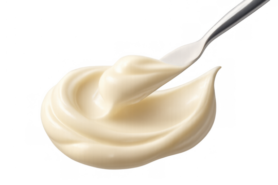 Mayonnaise condiment being spread by a metal spoon, creating a swirl. Food dressing with transparent background