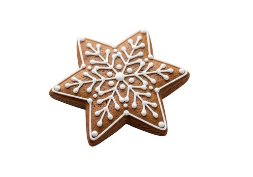 Delicious star shaped gingerbread cookie decorated with white royal icing snowflake pattern, isolated on transparent background