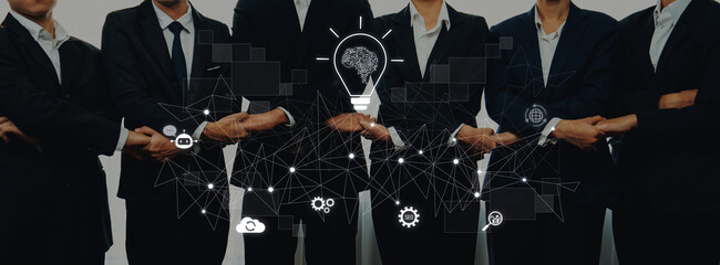 A group of business professionals stands together, symbolizing collaboration and innovation, with technology graphics representing modern ideas and growth strategies. Trope