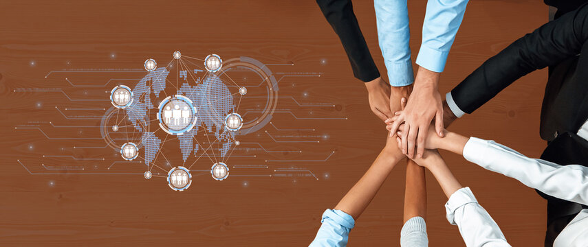 Collaborative Business Strategy Concept with Team Hands Overlaid on World Map and Network Connections in Modern Office Setting Trope.