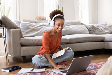 Happy young adult African American student girl taking training course