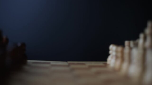 Rotating chessboard with strategically placed pieces in motion, depicting the eternal struggle between black and white factions in cerebral gameplay.