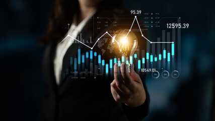 A businesswoman analyzes digital data visualization with various graphs and charts, representing market trends and financial growth for strategic investment decisions. Scalp