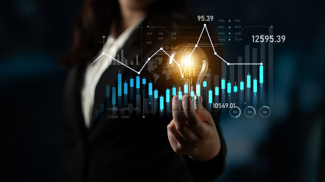 A businesswoman analyzes digital data visualization with various graphs and charts, representing market trends and financial growth for strategic investment decisions. Scalp