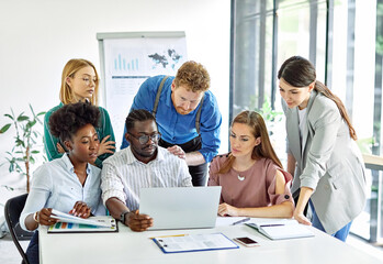 Group of young business people using laptop having a meeting or presentation and seminar in the office