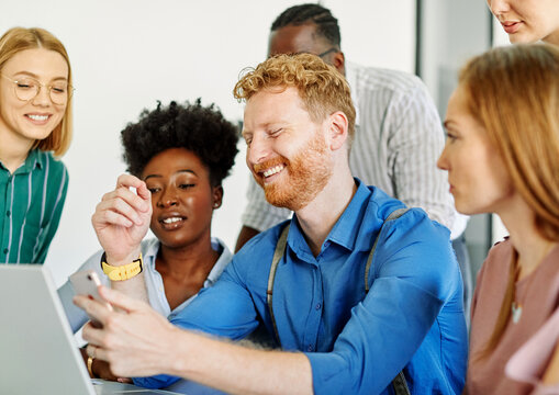 Group of young business people using laptop having a meeting or online presentation and seminar in the office