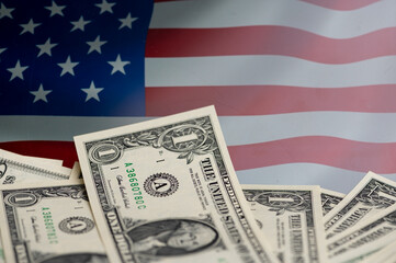 Money resting on an American flag background