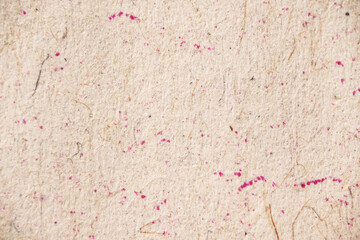 Beige Recycled Paper with Pink Ink Specks Macro
