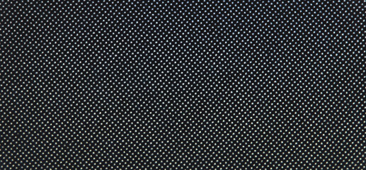 Macro of White Dot Matrix Pattern on Dark Printed Surface