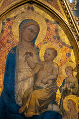 Obraz premium Painting (15th century) of Blessed Virgin Mary holding baby Jesus Christ in her arms.