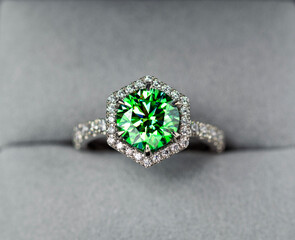 A green diamond ring with a white band