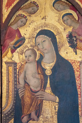 Obraz premium Painting (14th century) of Blessed Virgin Mary holding baby Jesus Christ in her arms.