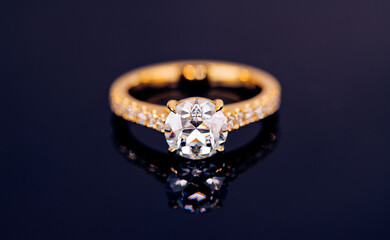 A gold and white ring with a diamond in the center