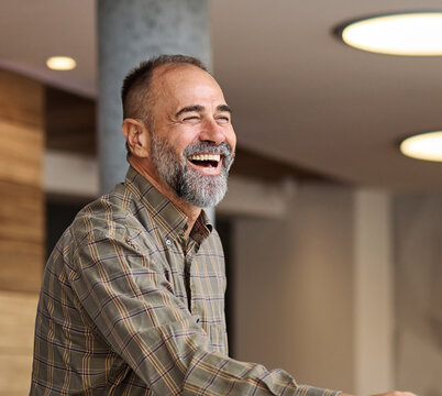Group of  businesspeople having a meeting shaking hands handshake introducing each other and applauding during meeting in the office. Teamwork and success concept, portrait of a middle aged mature bus