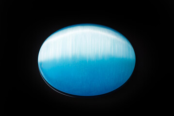 A blue stone with a blue and white stripe