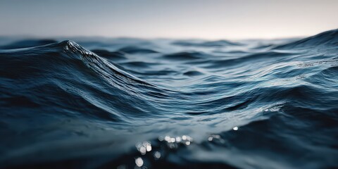 Close Up Ocean Wave with Surface Reflections in Shades of Blue and White