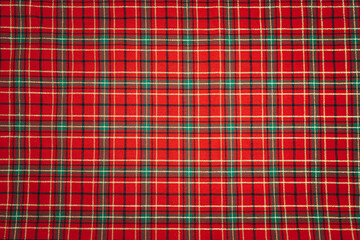 Red checkered Christmas background with gold details.
