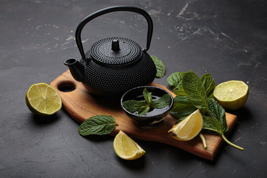 Black cast iron teapot refreshing mint lime herbal tea fresh relax healthy detox