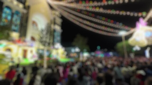 Bokeh view of Ba Lang catholic church on Christmas Eve, Nha Trang, Vietnam. Blurred background footage.