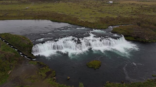 AERIAL Faxi waterfall flowing through green valley
Drone view of Iceland&rsquo;s Faxi waterfall and surrounding nature, captured in 2025.
