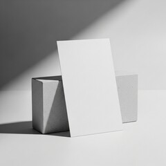 Minimalist White Card Mockup with Concrete Blocks and Diagonal Shadows