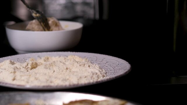 homemade fried fish in batter step by step. step 3 sunflower oil is poured onto a frying pan heated on the stove. High quality 4k footage
