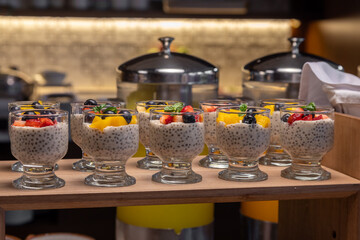 Breakfast buffet with a variety of breads, cereals, yogurt, and desserts