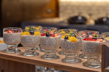 Breakfast buffet with a variety of breads, cereals, yogurt, and desserts