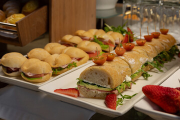 Breakfast buffet with a variety of breads, cereals, yogurt, and desserts