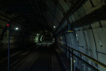 São Paulo, SP, Brazil - November 08th, 2025: Tunnel descending and with signage on Line 4 (Yellow Line) of the subway.