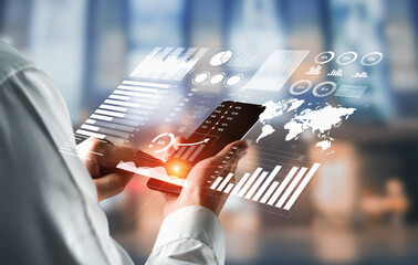 A professional using a smartphone to access dynamic business charts and graphs, showcasing data analysis in a modern office environment. Impute