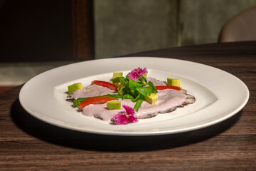 Traditional Peruvian food, octopus with olive sauce