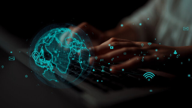 A close-up view of hands typing on a laptop, overlayed with a digital world map and connection icons, showcasing the essence of global communication and technology innovations. Xenic