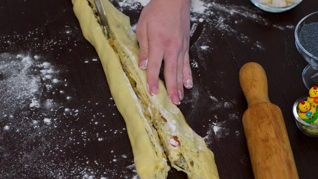 baking for Christmas Easter Making homemade cruffin step by step, rolling yeast dough, spreading butter and poppy seeds, adding dried fruits, baking layered cruffins, cooking process in the kitchen
