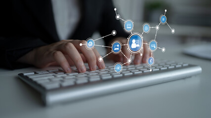 A professional setting showcasing hands typing on a keyboard with digital icons symbolizing online communication and networking, highlighting modern technology and collaboration. Tessel