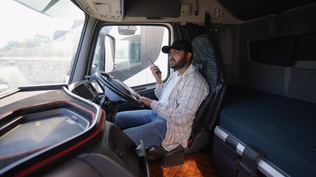Professional truck driver communicating using a cb radio in right hand drive car