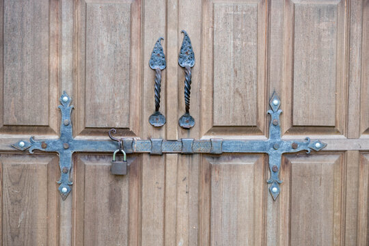 Old metal and wood lock of a wooden door