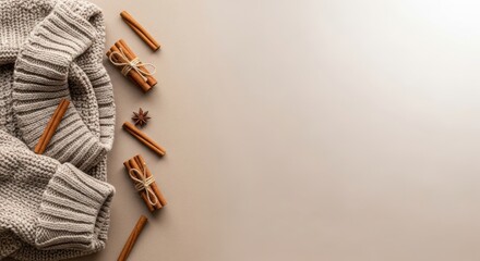 Cozy winter arrangement: Knitted sweater, cinnamon sticks and anise star