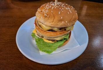 Gourmet Cheeseburger with Lettuce and Melted Cheese