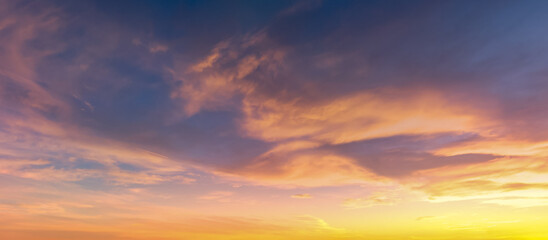 Vibrant Sunset Cloudscape Over a Calm Horizon With Orange and Purple Sky Colors