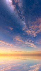 Starlit Night Sky Over Calm Ocean at Sunset With Milky Way Cloudscape